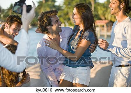 Group of friends enjoying at a tourist resort View Large Photo Image Stock Image - Group of friends enjoying at a tourist resort. Fotosearch