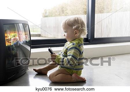 Little boy watching TV View Large Photo Image Stock Photograph - Little boy watching TV. Fotosearch