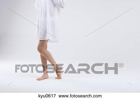 Low section view of a woman View Large Photo Image Stock Photo - Low section view of a woman. Fotosearch
