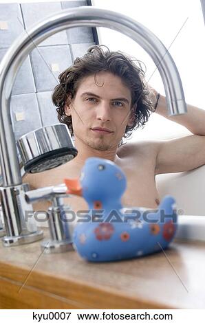 Man having a bath, looking at the camera View Large Photo Image Stock Photo - Man having a bath, looking at the camera. Fotosearch