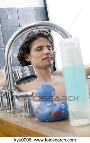 Man having a bath View Large Photo Image Stock Photograph - Man having a bath. Fotosearch
