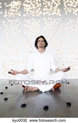 Man in yoga position, sitting cross-legged View Large Photo Image Stock Image - Man in yoga position, sitting cross-legged. Fotosearch