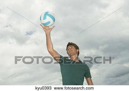 Man playing volleyball on the beach View Large Photo Image Stock Image - Man playing volleyball on the beach. Fotosearch