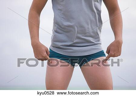 Man showing tan lines on his thighs View Large Photo Image Stock Photo - Man showing tan lines on his thighs. Fotosearch