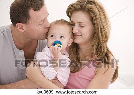 Parents loving their daughter View Large Photo Image Stock Photo - Parents loving their daughter. Fotosearch