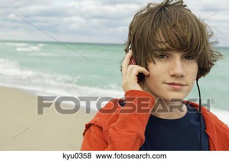 Portrait of a boy listening to headphones View Large Photo Image Stock Photo - Portrait of a boy listening to headphones. Fotosearch