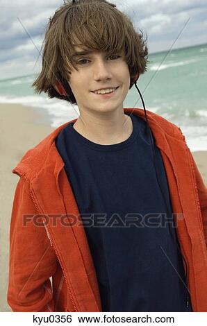 Portrait of a boy listening to headphones View Large Photo Image Stock Photograph - Portrait of a boy listening to headphones. Fotosearch
