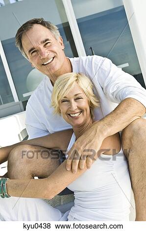 Portrait of a couple smiling View Large Photo Image Stock Photo - Portrait of a couple smiling. Fotosearch