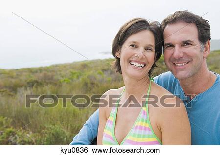 Portrait of a couple smiling View Large Photo Image Stock Photograph - Portrait of a couple smiling. Fotosearch