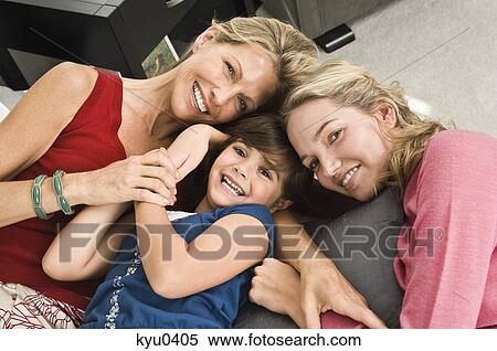 Stock Photography - Portrait of a family smiling. Fotosearch