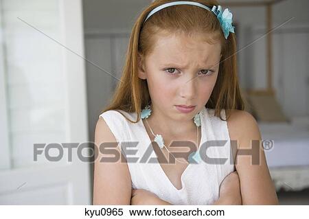 Portrait of a girl looking displeased View Large Photo Image Stock Photography - Portrait of a girl looking displeased. Fotosearch