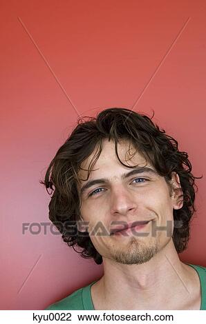 Portrait of a man smiling at the camera View Large Photo Image Stock Image - Portrait of a man smiling at the camera. Fotosearch