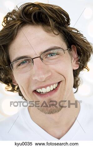 Portrait of a man smiling at the camera View Large Photo Image Stock Photography - Portrait of a man smiling at the camera. Fotosearch