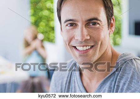 Stock Image - Portrait of a man smiling. Fotosearch
