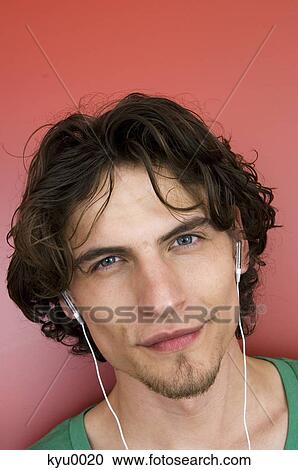 Portrait of a man with earphones View Large Photo Image Stock Image - Portrait of a man with earphones. Fotosearch