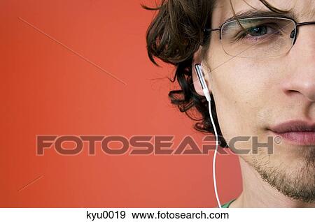 Portrait of a man with earphones View Large Photo Image Stock Photo - Portrait of a man with earphones. Fotosearch