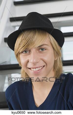 Portrait of a teenage boy smiling View Large Photo Image Stock Image - Portrait of a teenage boy smiling. Fotosearch