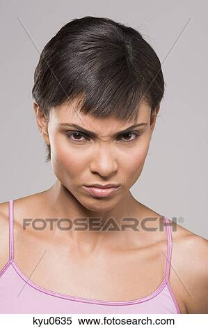 Portrait of a woman frowning View Large Photo Image Stock Photography - Portrait of a woman frowning. Fotosearch