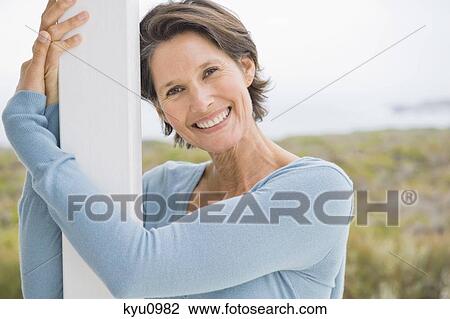 Portrait of a woman smiling View Large Photo Image Stock Image - Portrait of a woman smiling. Fotosearch