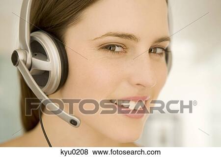 Portrait of a young woman, listening to music with headphones View Large Photo Image Stock Photo - Portrait of a young woman, listening to music with headphones. Fotosearch