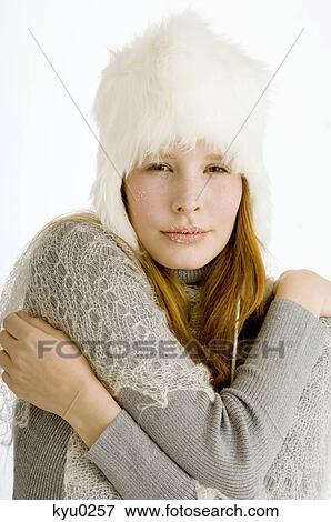 Portrait of a young woman shivering with cold View Large Photo Image Stock Photo - Portrait of a young woman shivering with cold. Fotosearch