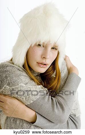 Portrait of a young woman shivering with cold View Large Photo Image Stock Photo - Portrait of a young woman shivering with cold. Fotosearch