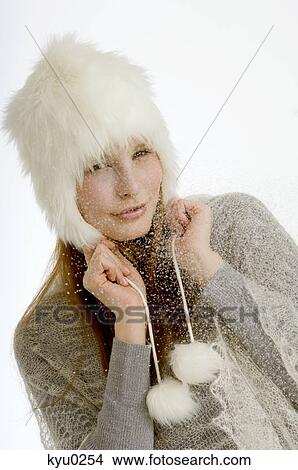 Picture - Portrait of a young woman wearing a fur hat. Fotosearch