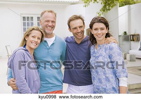 Portrait of two couples smiling together View Large Photo Image Stock Photo - Portrait of two couples smiling together. Fotosearch