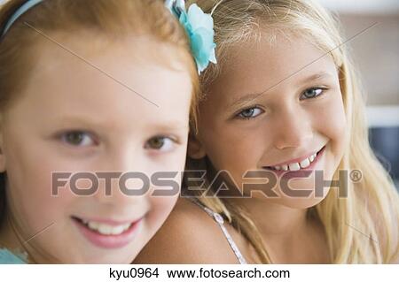 Picture - Portrait of two girls smiling. Fotosearch