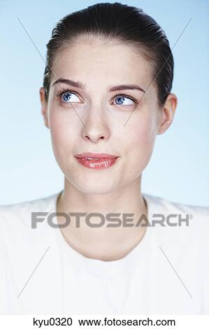 Portrait of young woman looking up View Large Photo Image Stock Image - Portrait of young woman looking up. Fotosearch