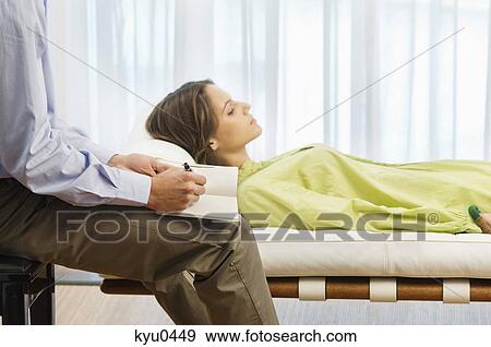 Psychiatrist examining a female patient View Large Photo Image Stock Photo - Psychiatrist examining a female patient. Fotosearch