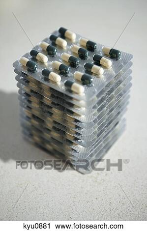 Stock Image - Stack of blister packs of capsules. Fotosearch