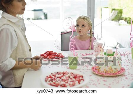 Two children in a birthday party View Large Photo Image Stock Image - Two children in a birthday party. Fotosearch