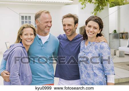 Two couples smiling View Large Photo Image Stock Photo - Two couples smiling. Fotosearch