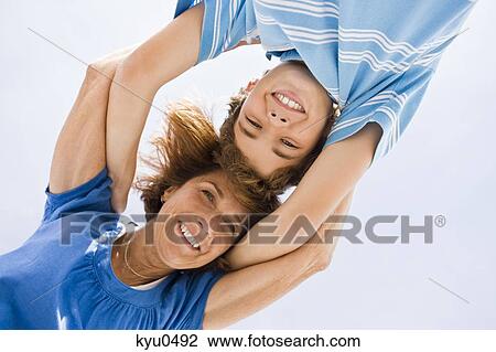 Woman and her grandson huddle together View Large Photo Image Stock Image - Woman and her grandson huddle together. Fotosearch