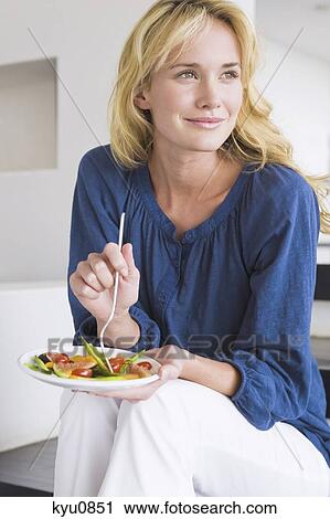 Woman holding a plate of fruit salad View Large Photo Image Stock Image - Woman holding a plate of fruit salad. Fotosearch