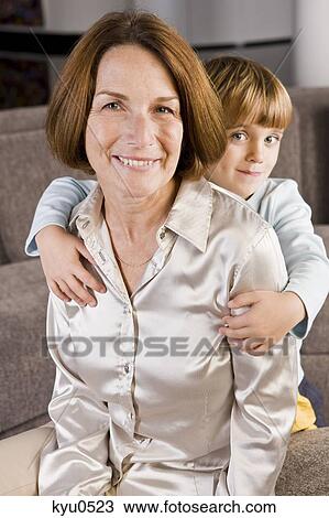 Woman smiling with her grandson View Large Photo Image Stock Image - Woman smiling with her grandson. Fotosearch