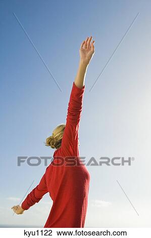 Woman stretching her arms View Large Photo Image Stock Image - Woman stretching her arms. Fotosearch