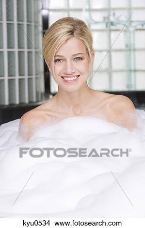 Woman taking a bubble bath View Large Photo Image Picture - Woman taking a bubble bath. Fotosearch