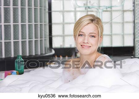 Woman taking a bubble bath View Large Photo Image Stock Photograph - Woman taking a bubble bath. Fotosearch