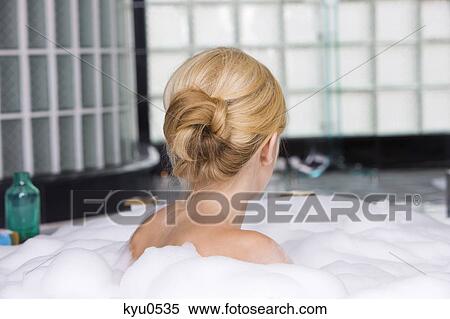 Woman taking a bubble bath View Large Photo Image Stock Photography - Woman taking a bubble bath. Fotosearch
