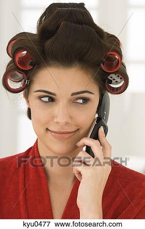 Woman talking on a mobile phone View Large Photo Image Stock Photo - Woman talking on a mobile phone. Fotosearch