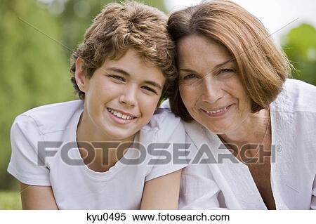 Woman with her grandson smiling View Large Photo Image Stock Photography - Woman with her grandson smiling. Fotosearch
