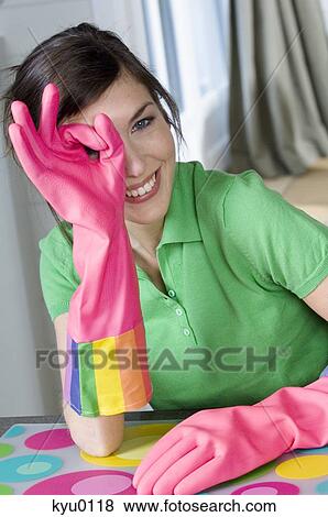 Young smiling woman with rubber gloves View Large Photo Image Stock Photo - Young smiling woman with rubber gloves. Fotosearch