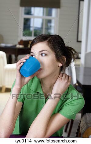 Young thinking woman drinking View Large Photo Image Picture - Young thinking woman drinking. Fotosearch
