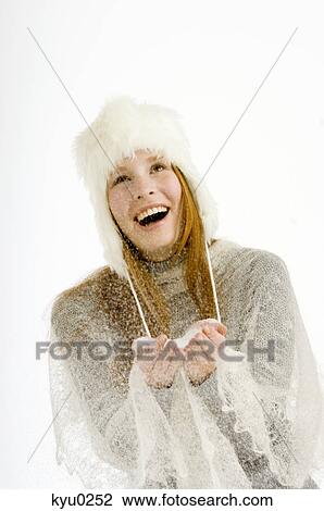 Young woman holding snow in her cupped hands and smiling View Large Photo Image Stock Image - Young woman holding snow in her cupped hands and smiling. Fotosearch