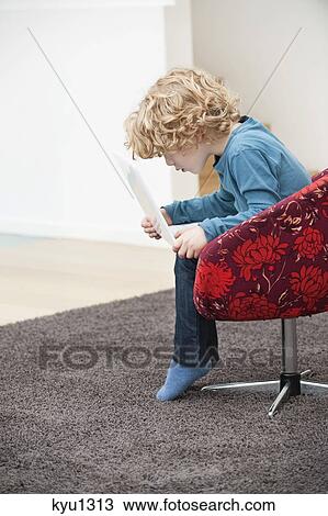 Boy using a laptop View Large Photo Image Stock Image - Boy using a laptop. Fotosearch
