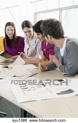 Business executives discussing in an office View Large Photo Image Stock Photo - Business executives discussing in an office. Fotosearch
