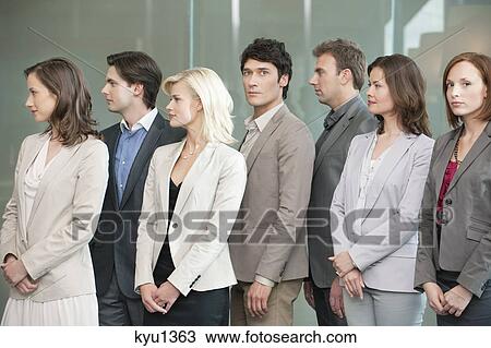 Business executives standing together View Large Photo Image Stock Image - Business executives standing together. Fotosearch