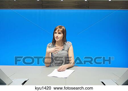 Businesswoman doing paperwork in a conference room View Large Photo Image Stock Image - Businesswoman doing paperwork in a conference room. Fotosearch